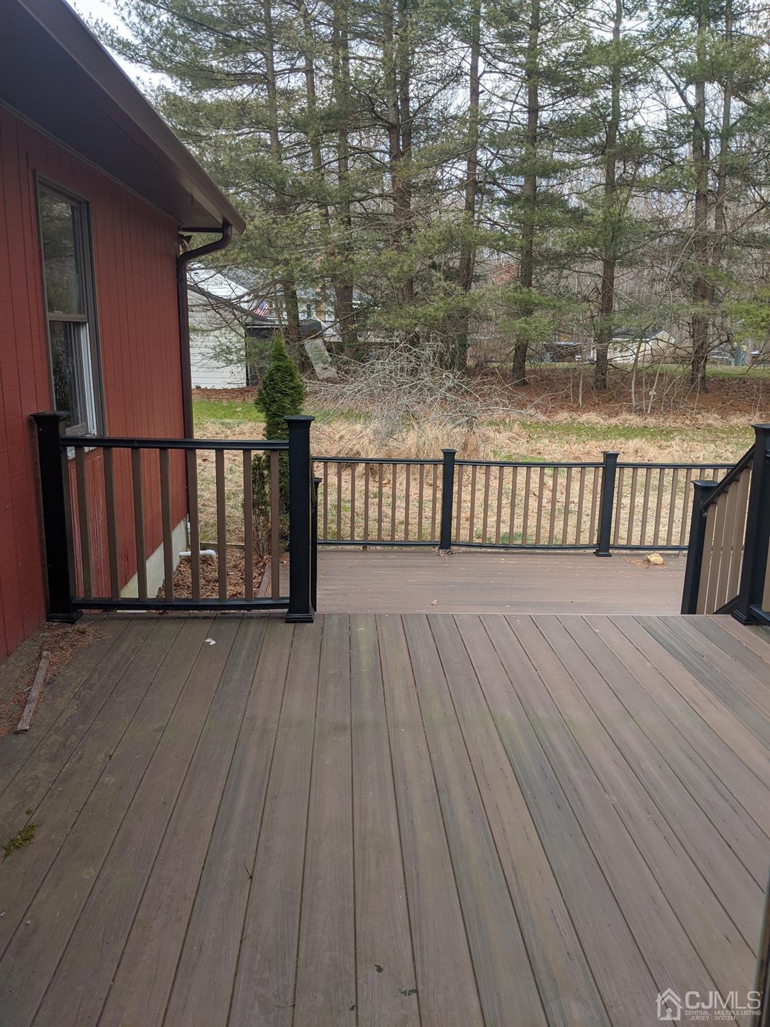 154 Broadway Road Cranbury, NJ 08512 - Photo 13 of 15 a view of deck with wooden floor and fence