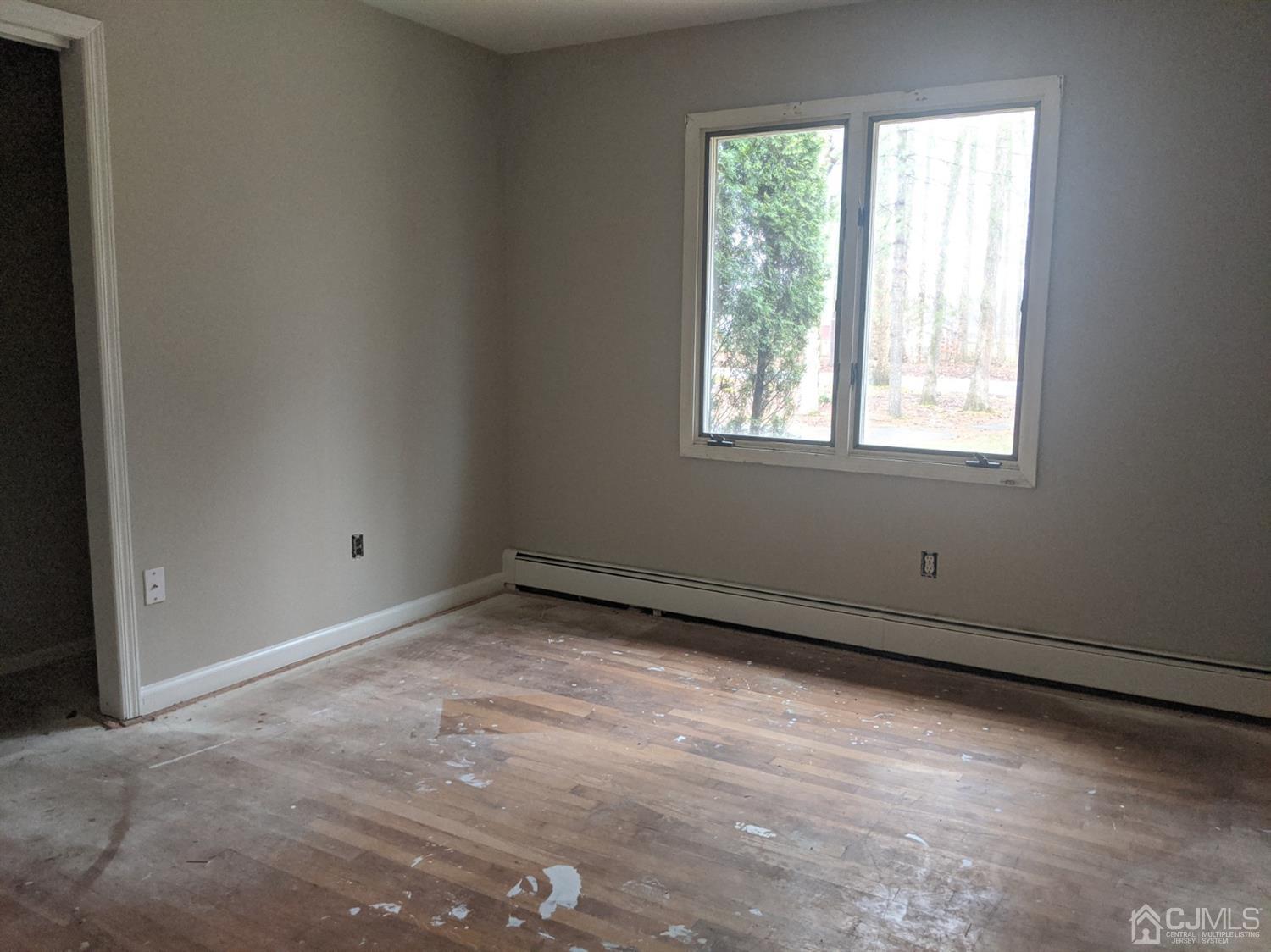 154 Broadway Road Cranbury, NJ 08512 - Photo 5 of 15 an empty room with a window