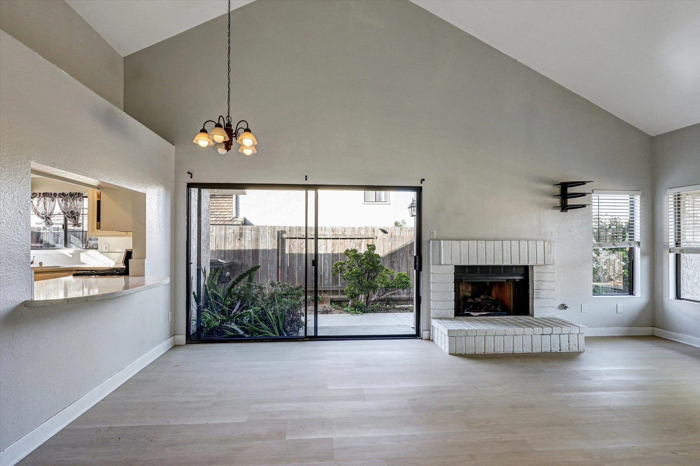 9488 Hiker Hill Road San Diego, CA 92129 - Photo 14 of 27 a view of a livingroom with an empty space and a fireplace