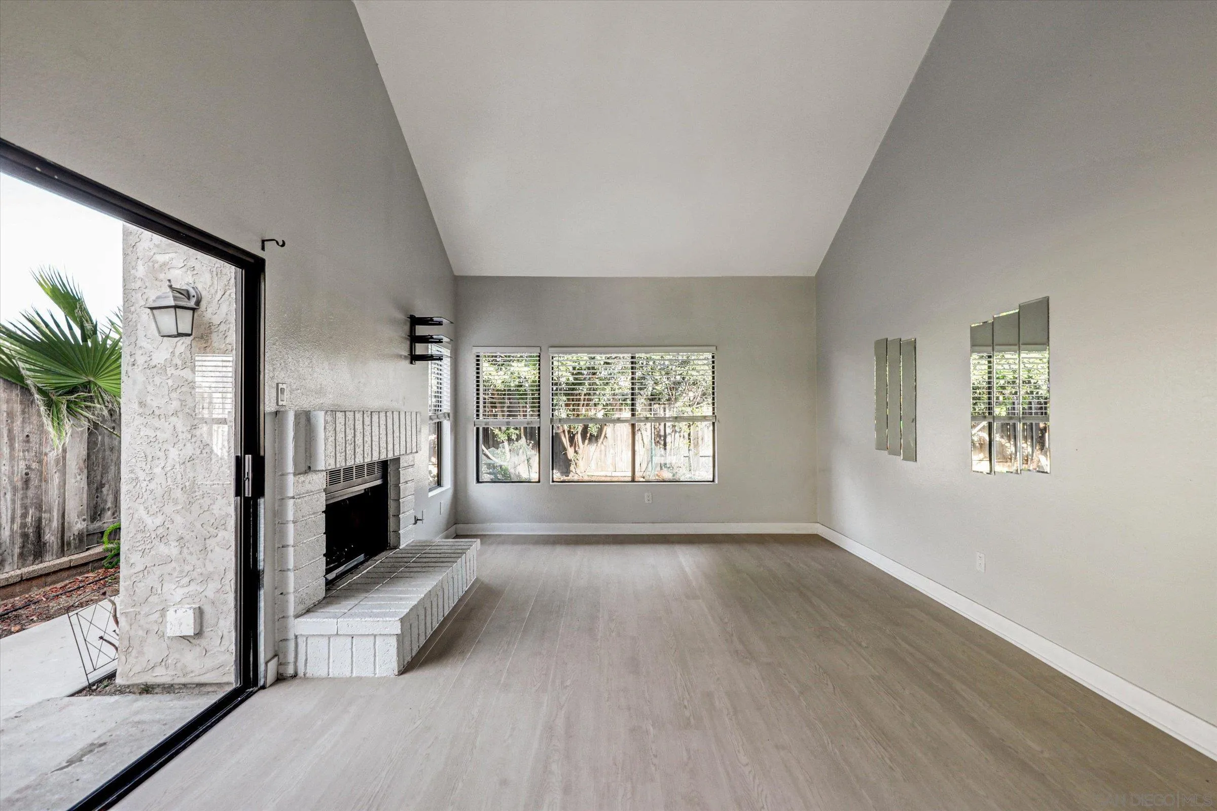 9488 Hiker Hill Road San Diego, CA 92129 - Photo 18 of 27 a living room with furniture and a fireplace