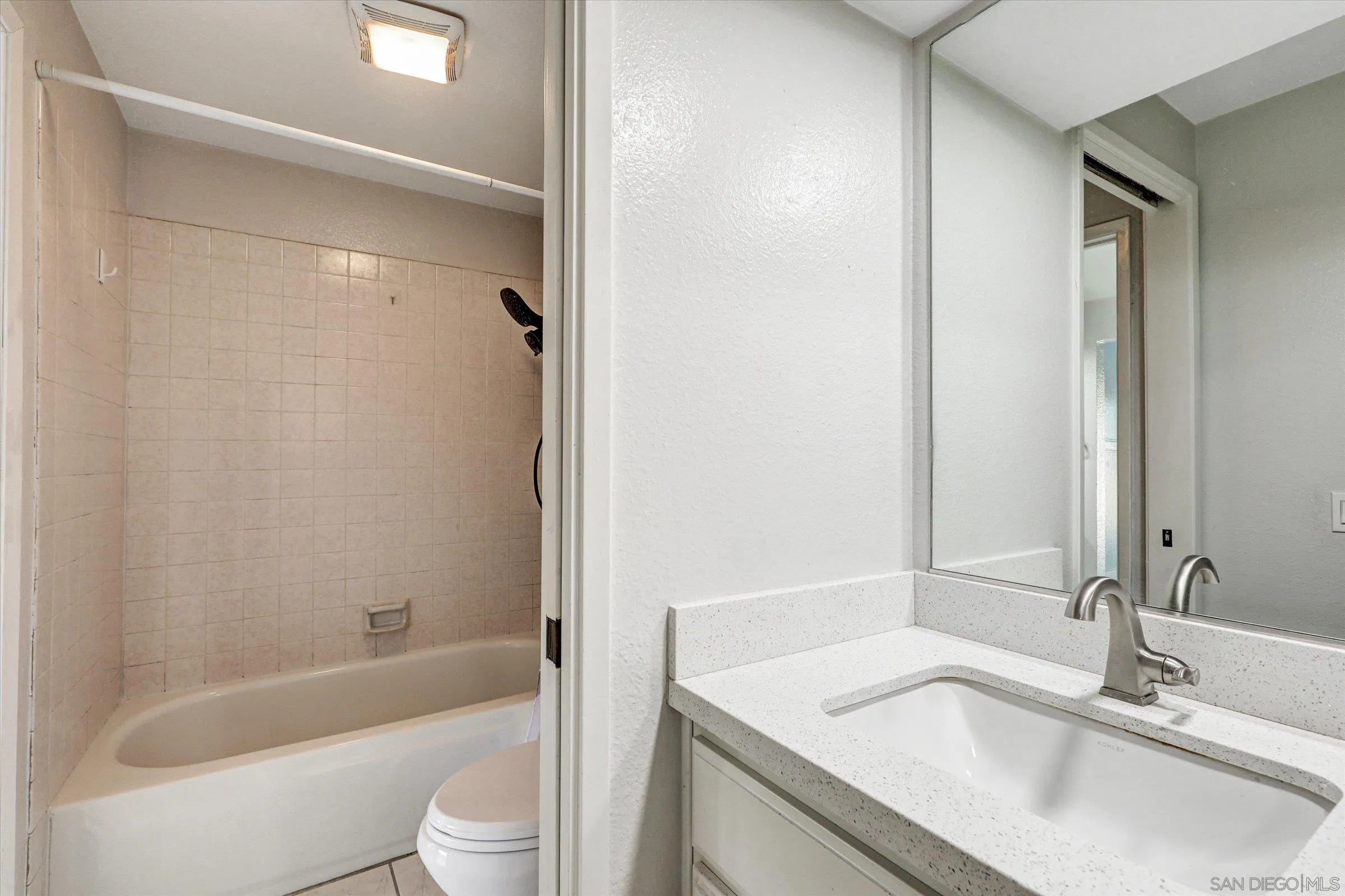 9488 Hiker Hill Road San Diego, CA 92129 - Photo 21 of 27 a bathroom with a sink a toilet and shower
