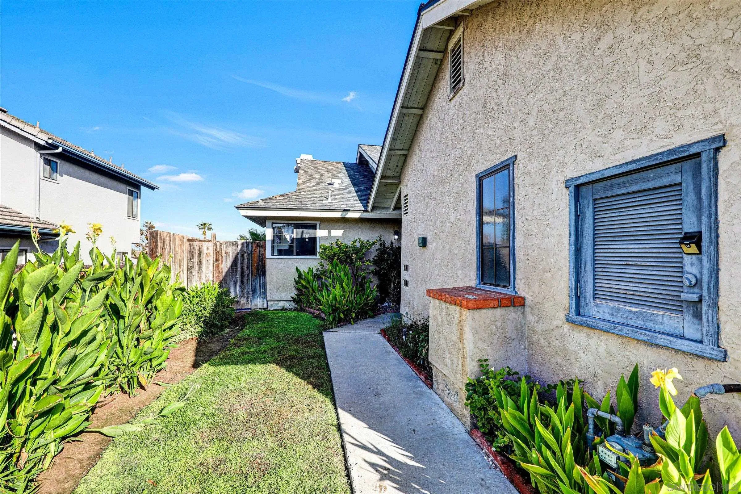 9488 Hiker Hill Road San Diego, CA 92129 - Photo 5 of 27 a front view of a house with a yard