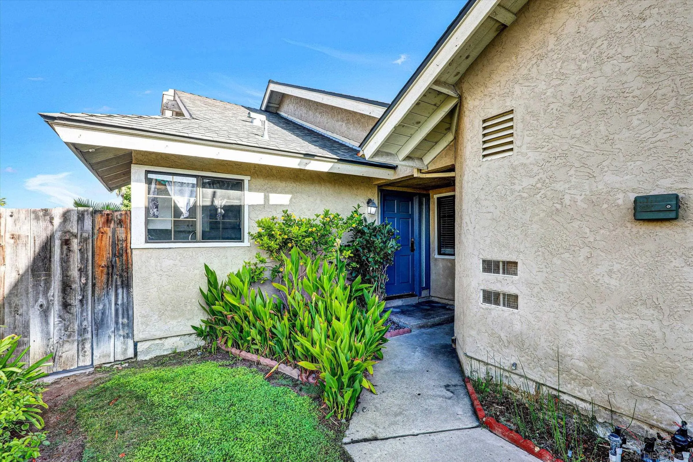 9488 Hiker Hill Road San Diego, CA 92129 - Photo 7 of 27 a front view of a house with garden