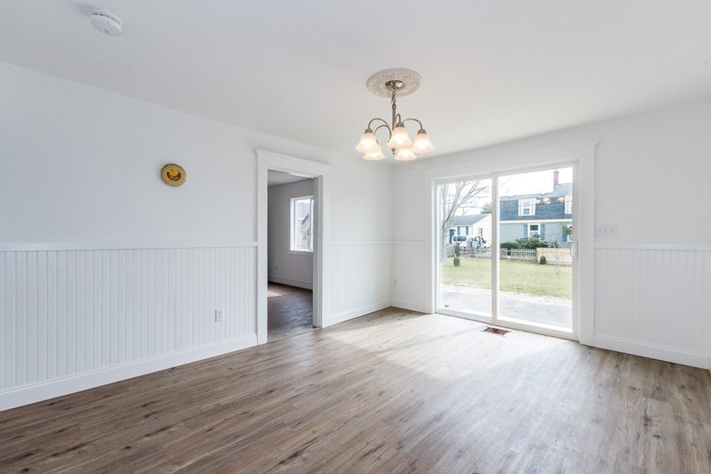 9 Camp Street Wareham, MA 02558 - Photo 13 of 30 a view of an empty room with glass door and wooden floor