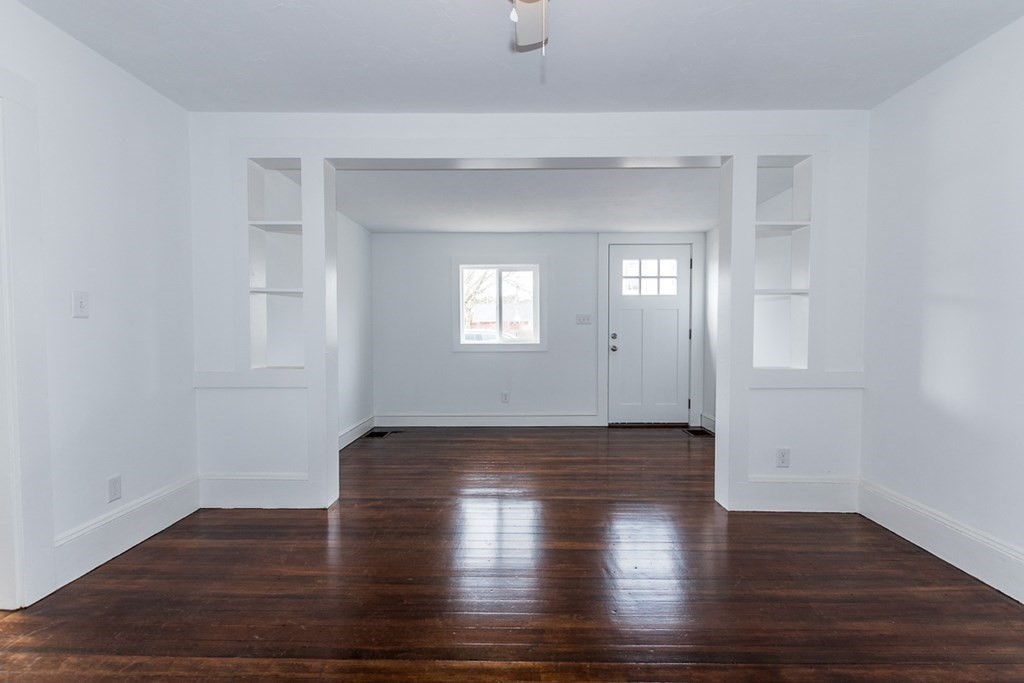 9 Camp Street Wareham, MA 02558 - Photo 15 of 30 a view of an empty room with wooden floor and window