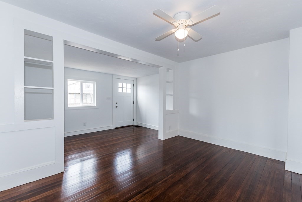 9 Camp Street Wareham, MA 02558 - Photo 16 of 30 an empty room with wooden floor and windows