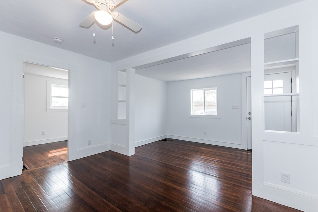 9 Camp Street Wareham, MA 02558 - Photo 17 of 30 an empty room with wooden floor and windows