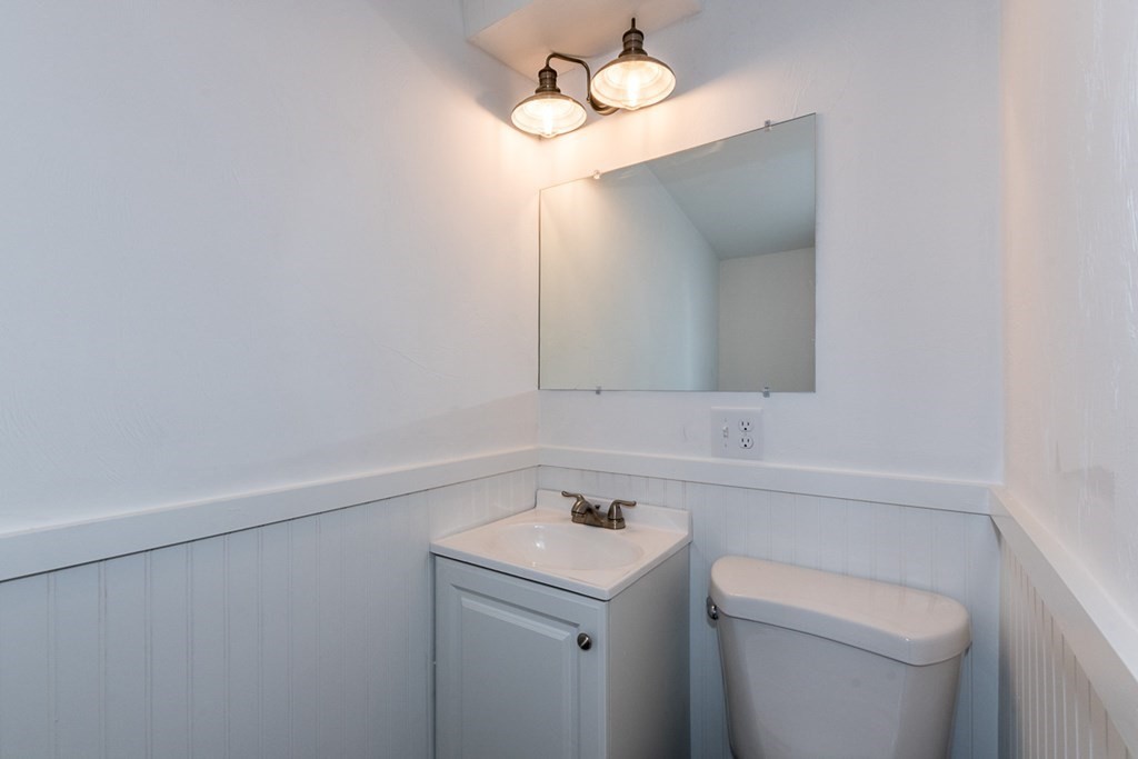9 Camp Street Wareham, MA 02558 - Photo 21 of 30 a bathroom with a sink a toilet and mirror