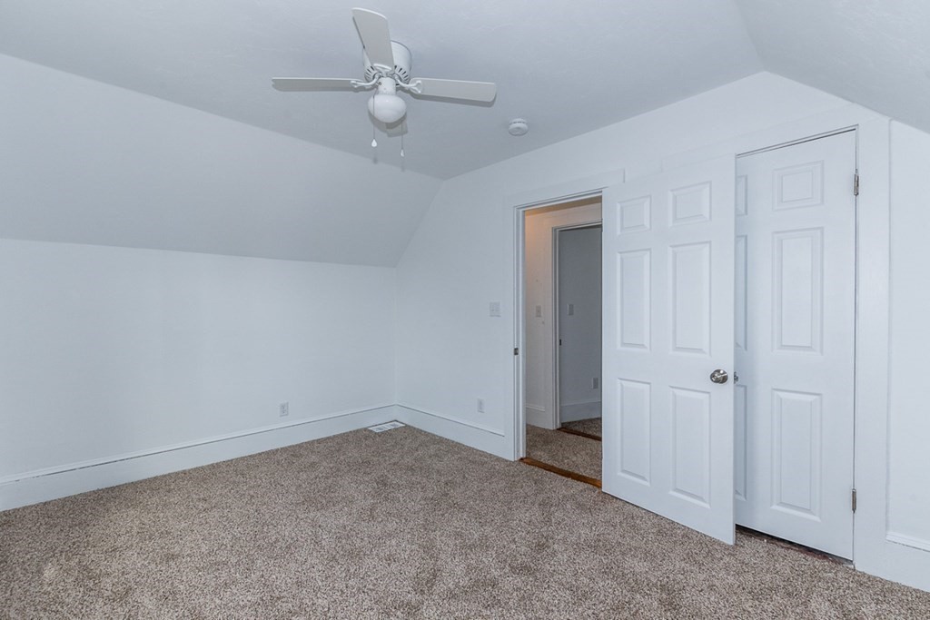 9 Camp Street Wareham, MA 02558 - Photo 24 of 30 an empty room with a ceiling fan and a window