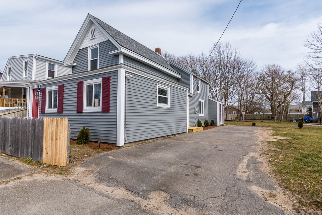 9 Camp Street Wareham, MA 02558 - Photo 3 of 30 a front view of a house with a yard