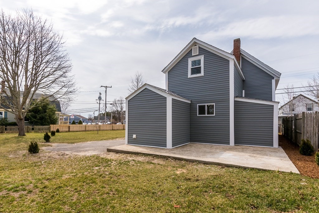 9 Camp Street Wareham, MA 02558 - Photo 5 of 30 a front view of a house with a yard