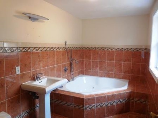 5 Kingsbury Road Webster, MA 01570 - Photo 14 of 29 a bathroom with a sink and a mirror