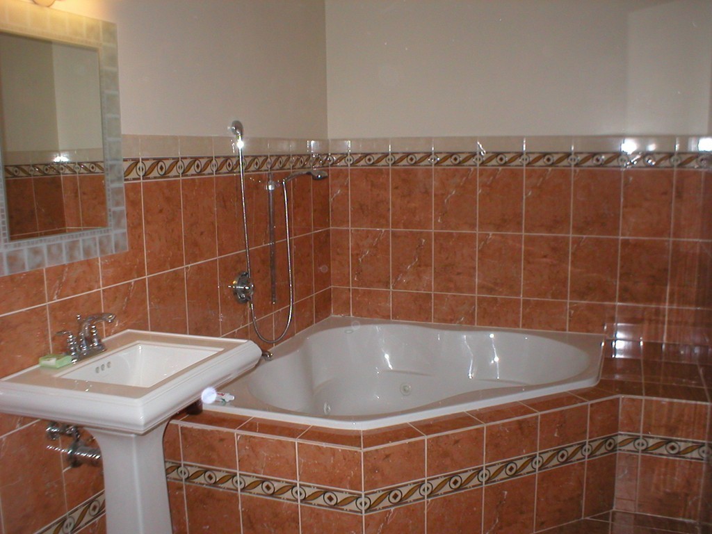 5 Kingsbury Road Webster, MA 01570 - Photo 15 of 29 a bathroom with a bath tub and shower