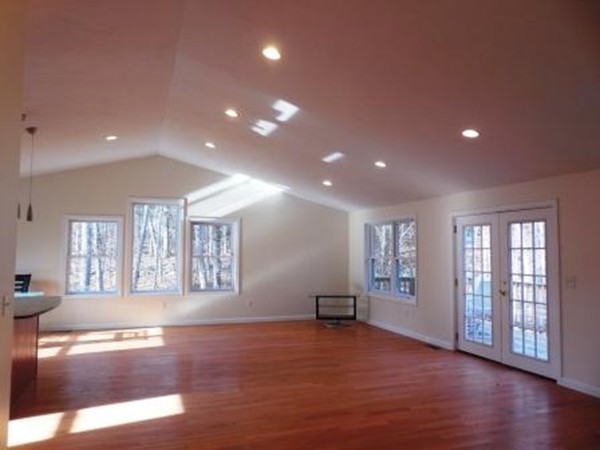 5 Kingsbury Road Webster, MA 01570 - Photo 2 of 29 a view of an empty room with a window and wooden floor