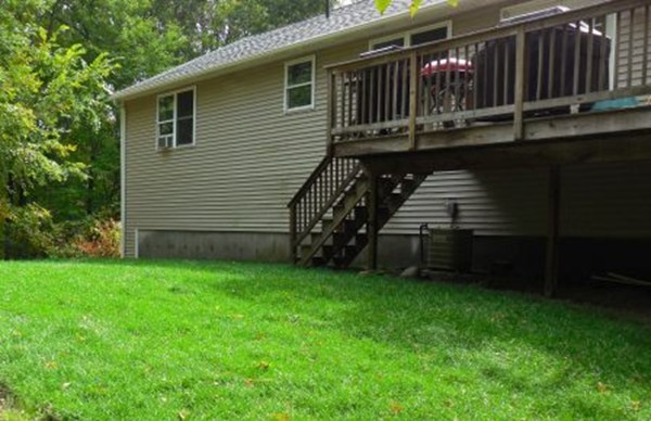 5 Kingsbury Road Webster, MA 01570 - Photo 27 of 29 a view of a house with a backyard