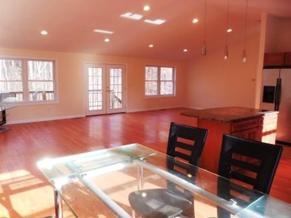 5 Kingsbury Road Webster, MA 01570 - Photo 5 of 29 a view of an empty room with window and wooden floor
