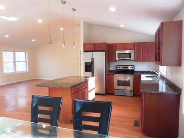 5 Kingsbury Road Webster, MA 01570 - Photo 6 of 29 a kitchen with stainless steel appliances granite countertop a refrigerator and a stove top oven