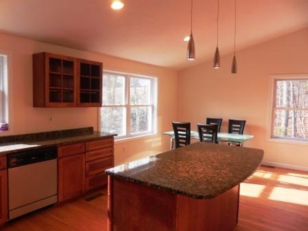 5 Kingsbury Road Webster, MA 01570 - Photo 7 of 29 a kitchen with a stove a sink a counter space and wooden floor