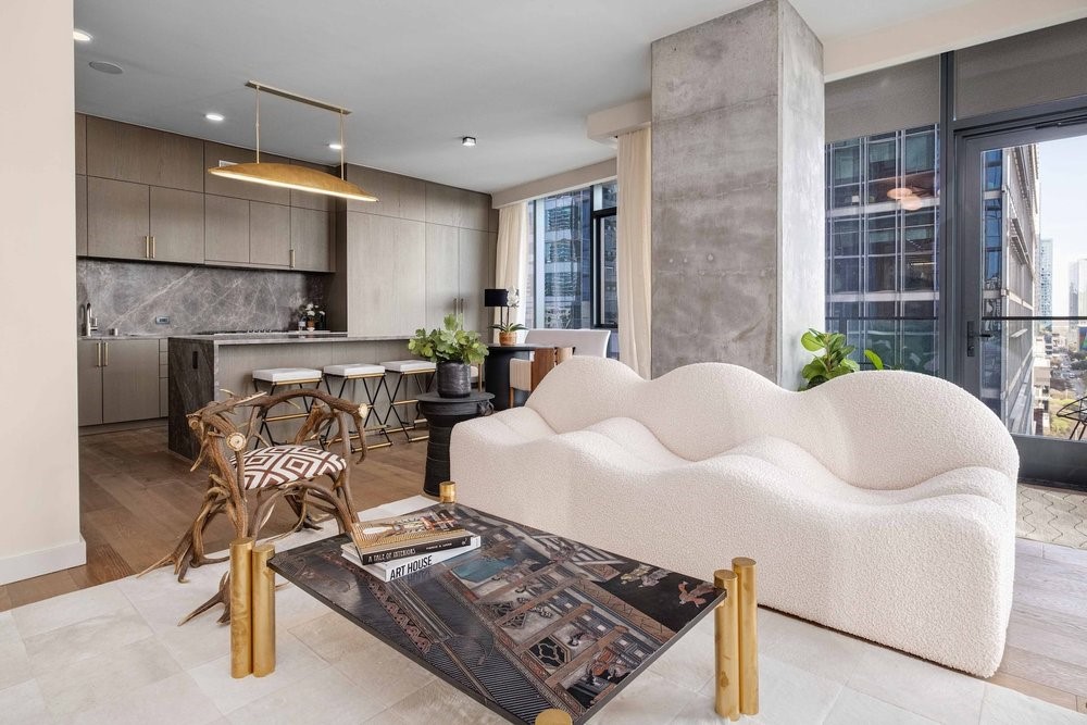 a living room with furniture and a lamp