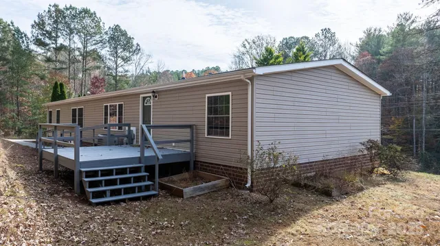 a backyard of a house with wooden fence and roof