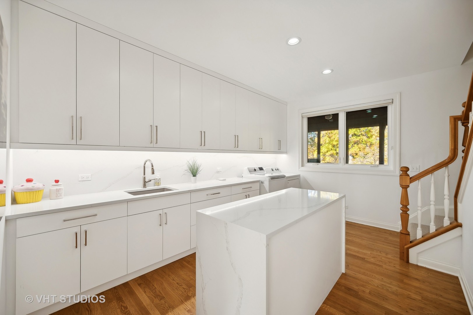1015 Sheridan Road Glencoe, IL 60022 - Photo 13 of 29 a kitchen with sink cabinets and wooden floor