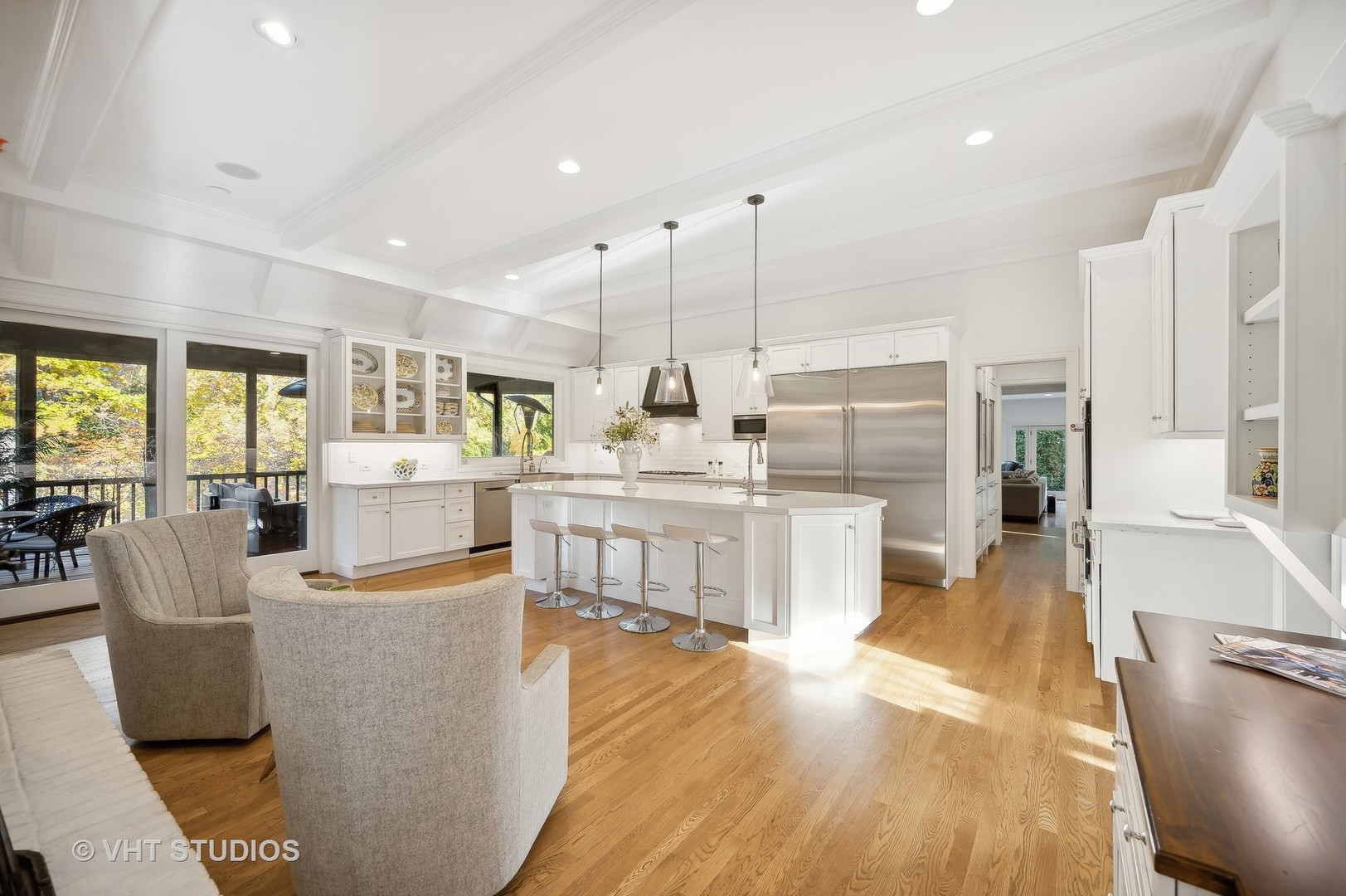 1015 Sheridan Road Glencoe, IL 60022 - Photo 9 of 29 a large kitchen with kitchen island a large counter top a stove a sink and a chandelier