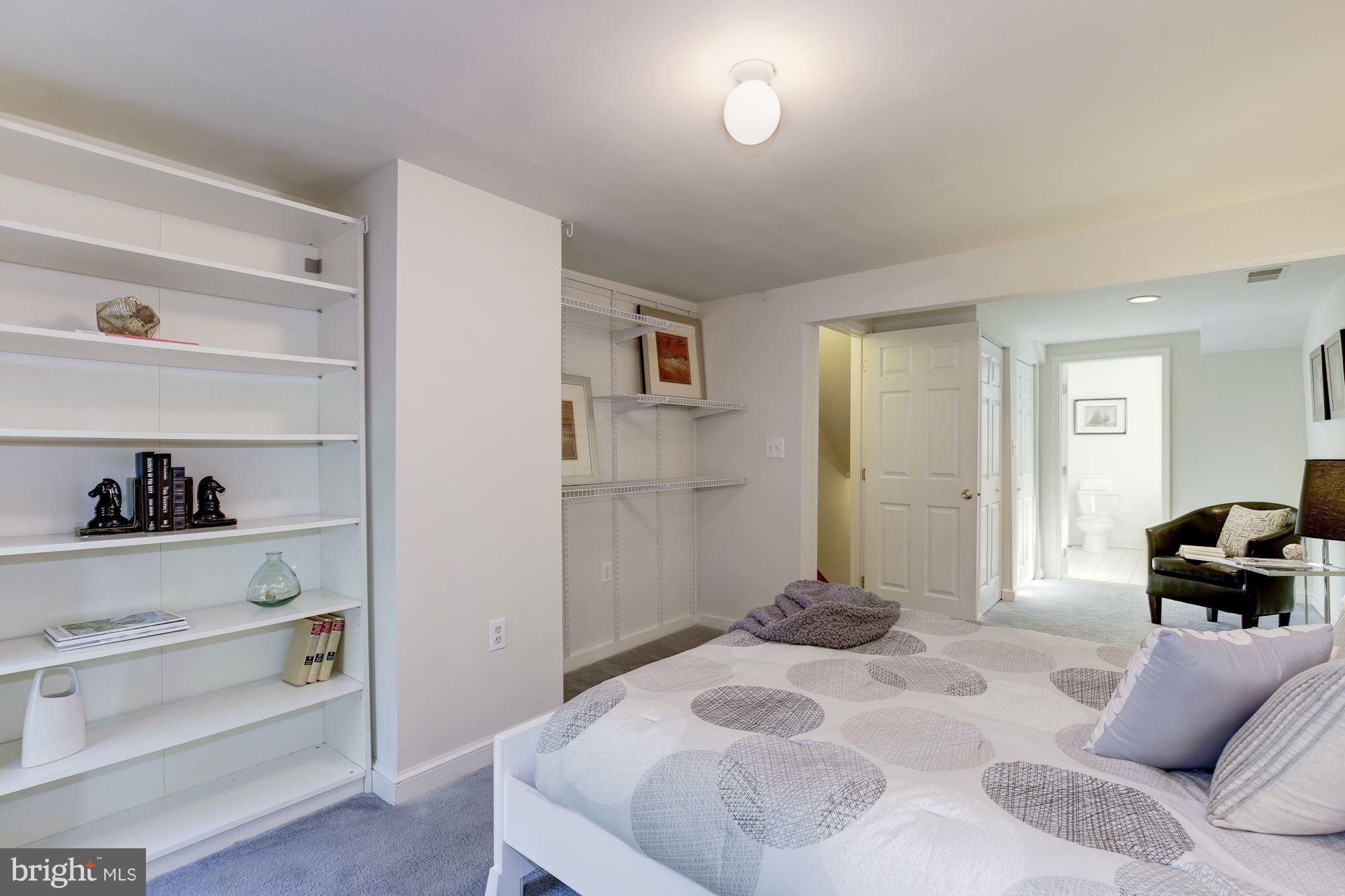 1341 Vermont Avenue Northwest Washington, DC 20005 - Photo 13 of 29 a bedroom with a bed and closet