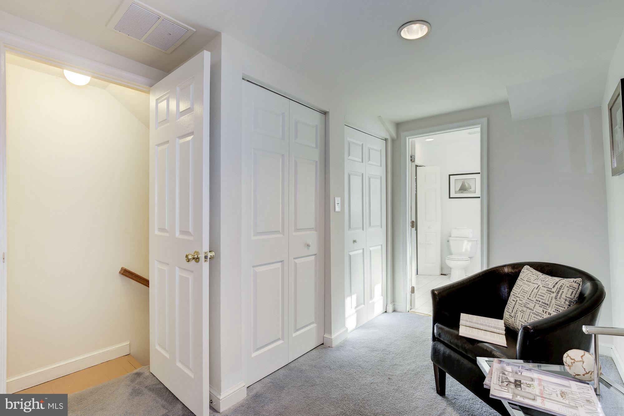 1341 Vermont Avenue Northwest Washington, DC 20005 - Photo 14 of 29 a bedroom with a bed a couch and a window