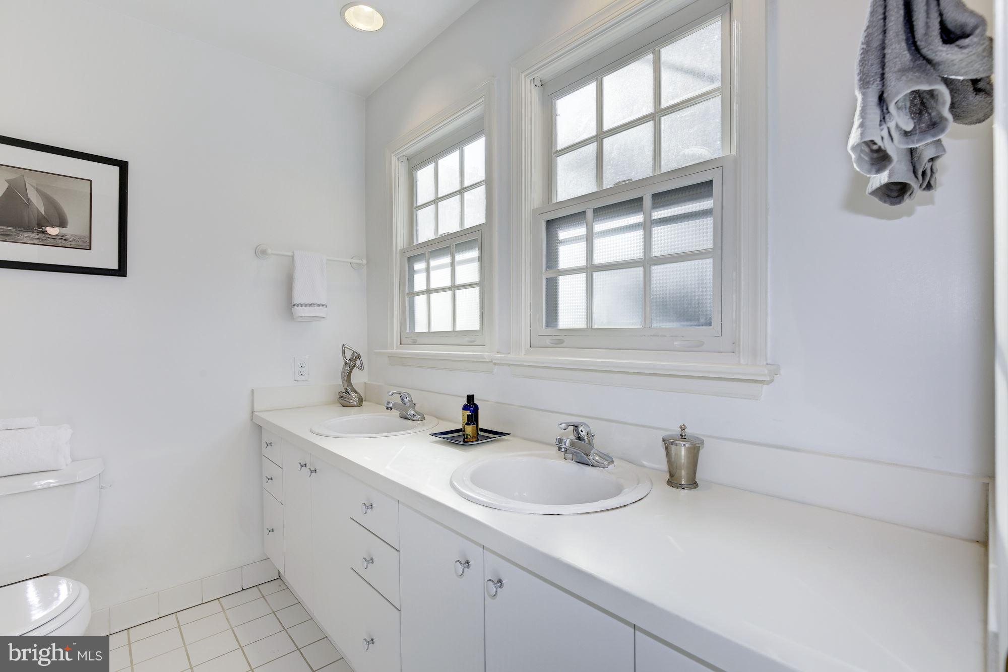 1341 Vermont Avenue Northwest Washington, DC 20005 - Photo 16 of 29 a bathroom with a sink toilet and vanity