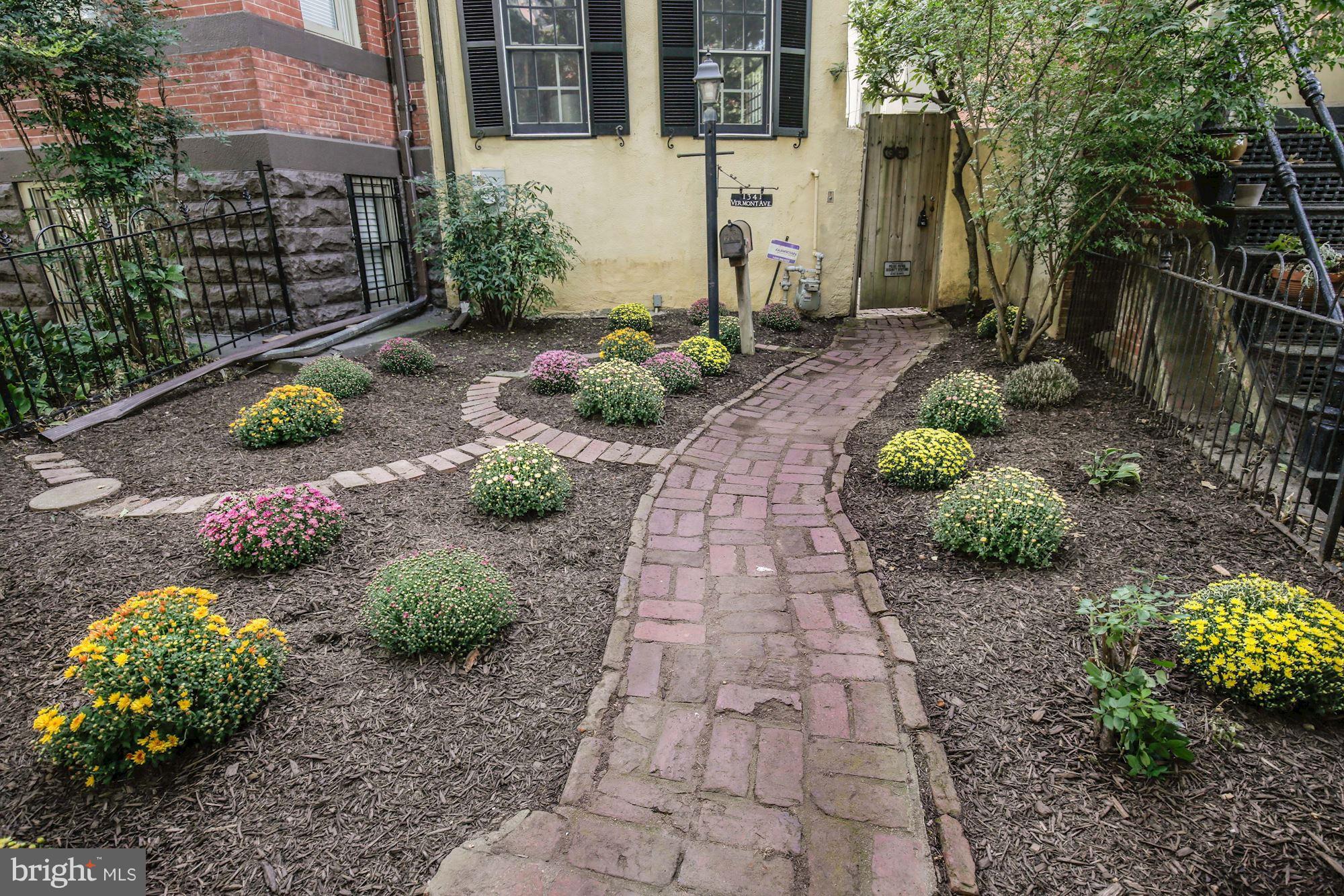 1341 Vermont Avenue Northwest Washington, DC 20005 - Photo 29 of 29 a view of a pathway with flower plants
