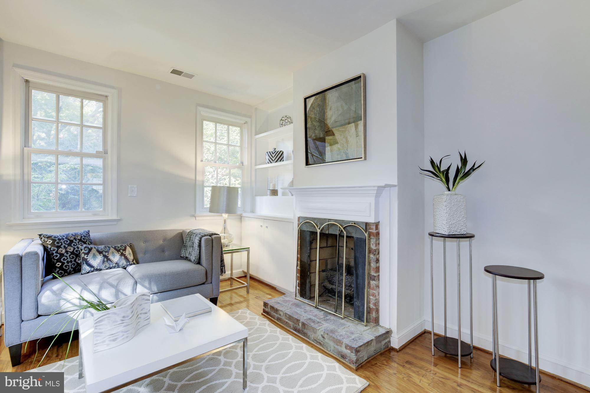 1341 Vermont Avenue Northwest Washington, DC 20005 - Photo 3 of 29 a living room with furniture and a fireplace