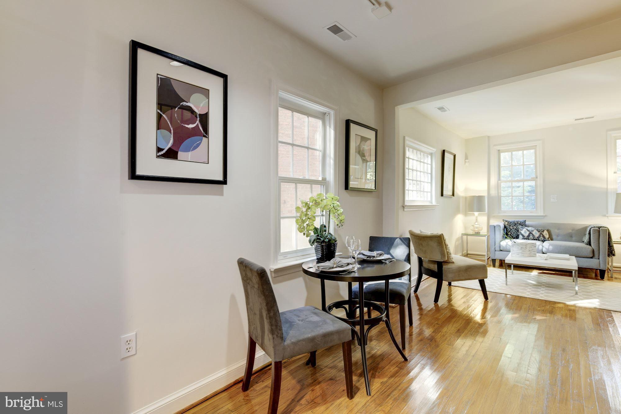 1341 Vermont Avenue Northwest Washington, DC 20005 - Photo 6 of 29 a view of a livingroom with furniture and a window