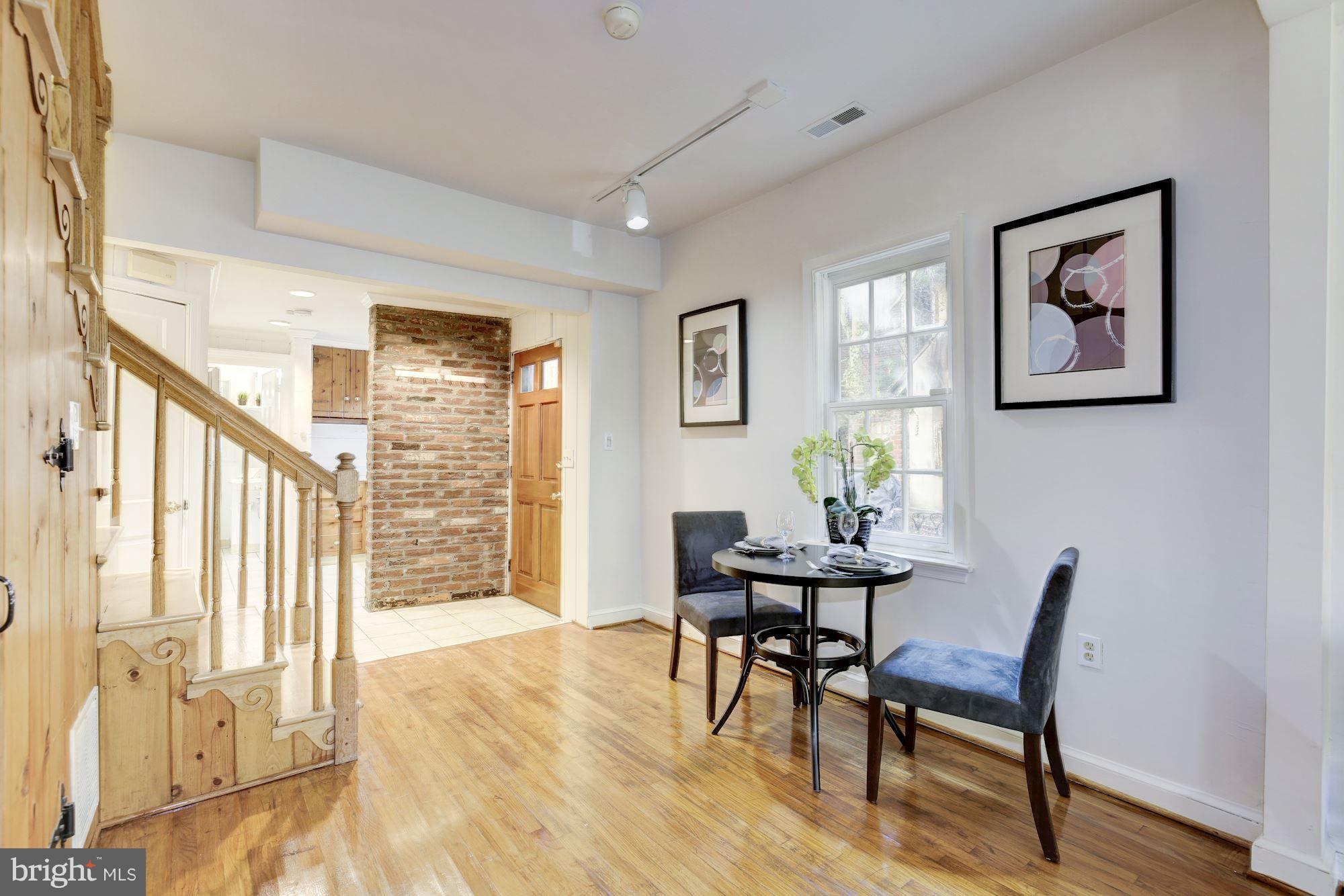 1341 Vermont Avenue Northwest Washington, DC 20005 - Photo 7 of 29 a view of a dining room with furniture and wooden floor