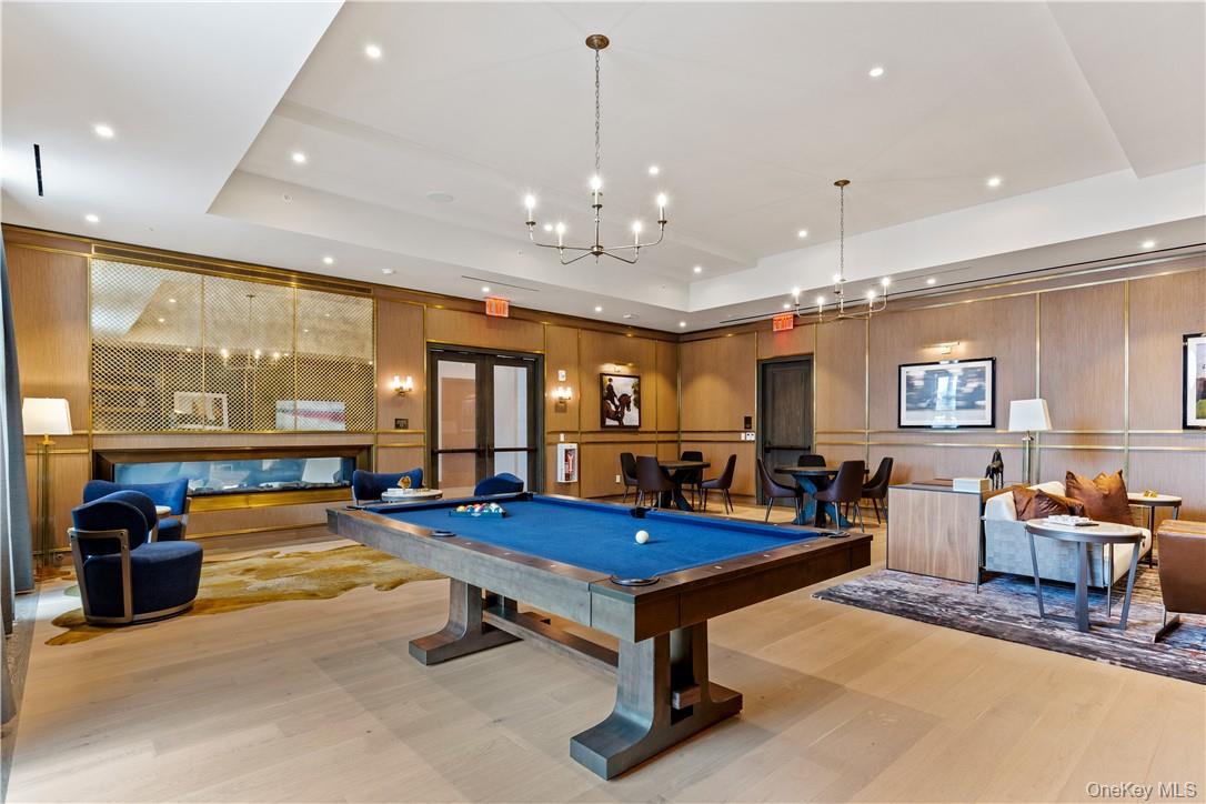 120 Old Post Road, Unit PHE303 Rye, NY 10580 - Photo 16 of 29 a living room with furniture pool table and a large window
