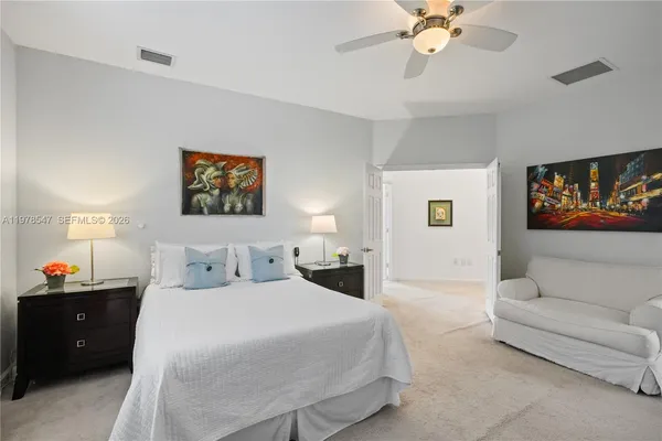 a bedroom with a bed and a couch