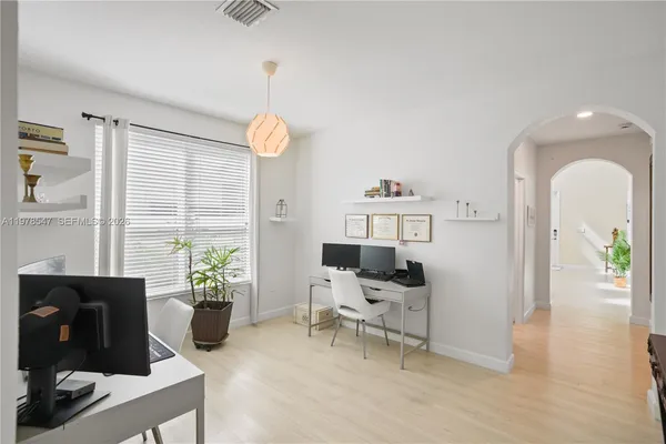 a living room with furniture and a window