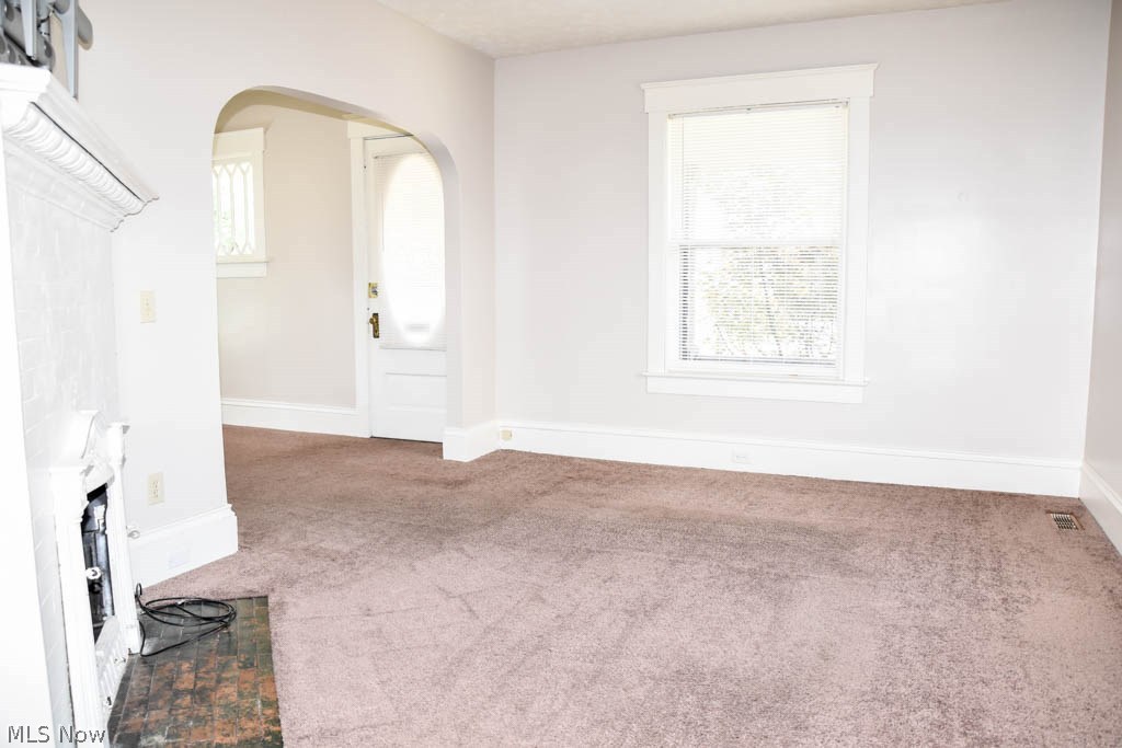 1210 Amherst Road Northeast Massillon, OH 44646 - Photo 2 of 15 Formal living room with arched doorways.