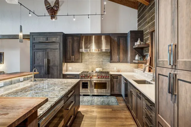 a kitchen with a stove and a sink