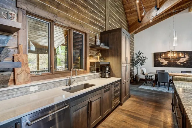 a spacious bathroom with a sink and a large mirror