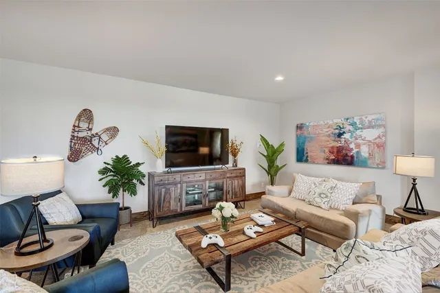 a living room with furniture or couch and a flat screen tv