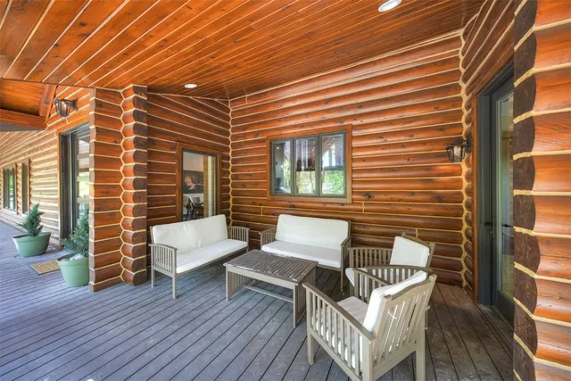 a view of a patio with wooden floor