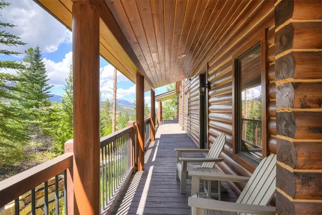 a view of a balcony with wooden floor