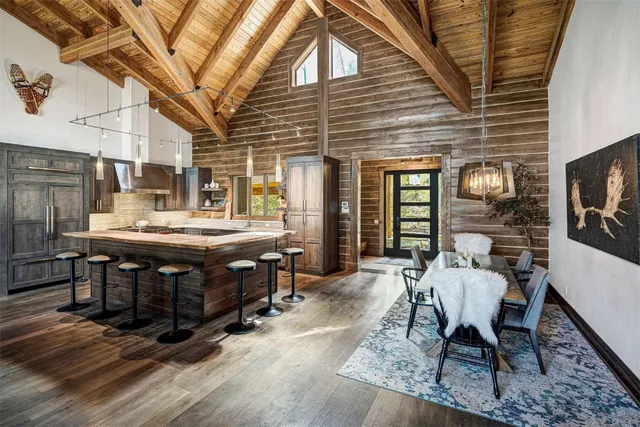 a view of a patio with table and chairs