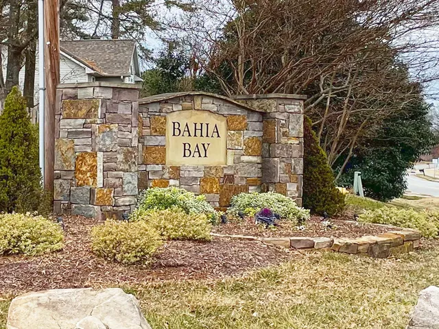 a front view of a building with trees