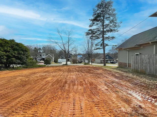 a pathway of a house with a yard