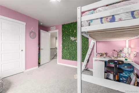a view of entryway with a lot of stuff and kitchen view