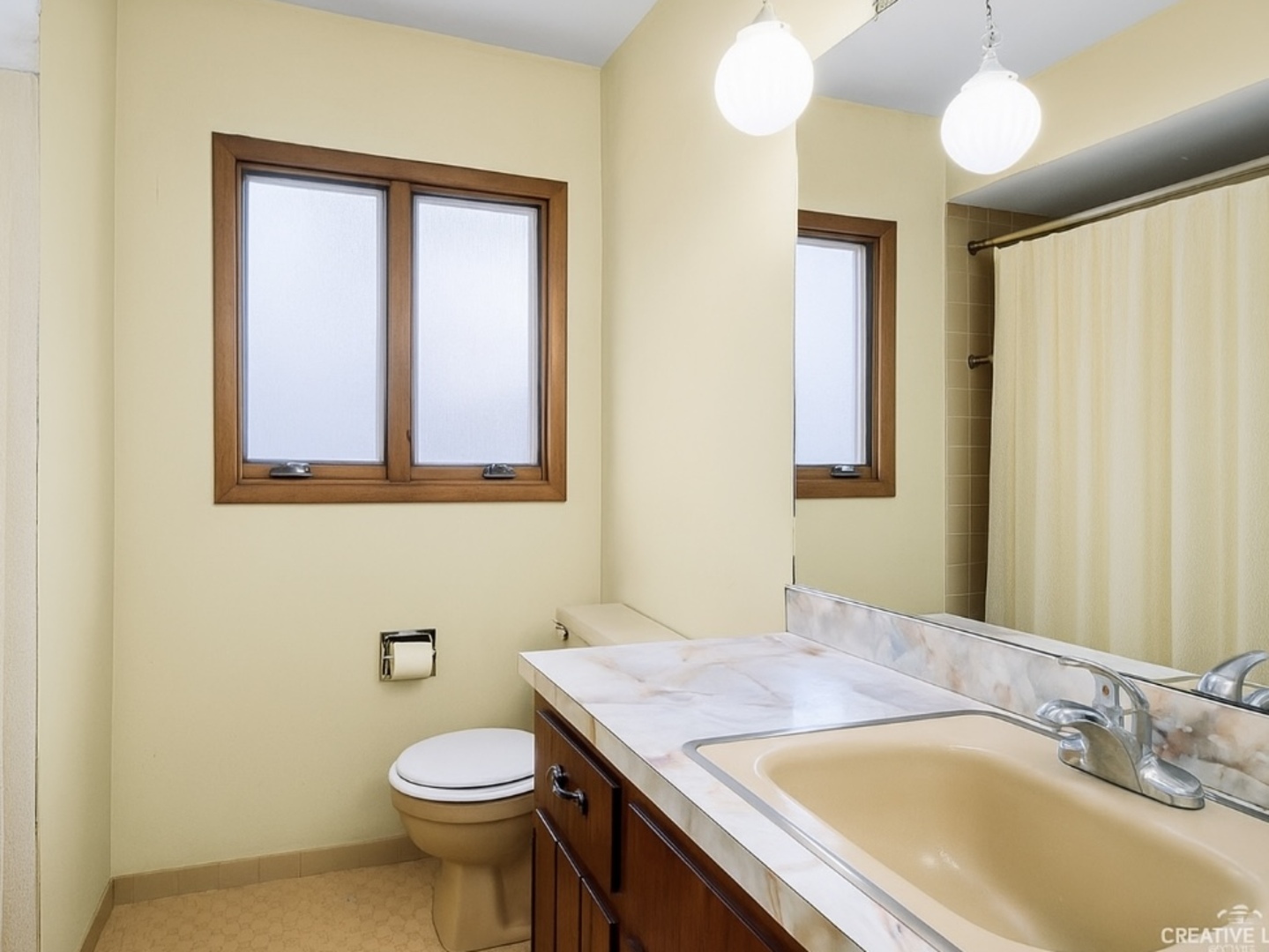 1408 Spruce Lane Westmont, IL 60559 - Photo 13 of 25 a bathroom with a granite countertop sink toilet and a mirror