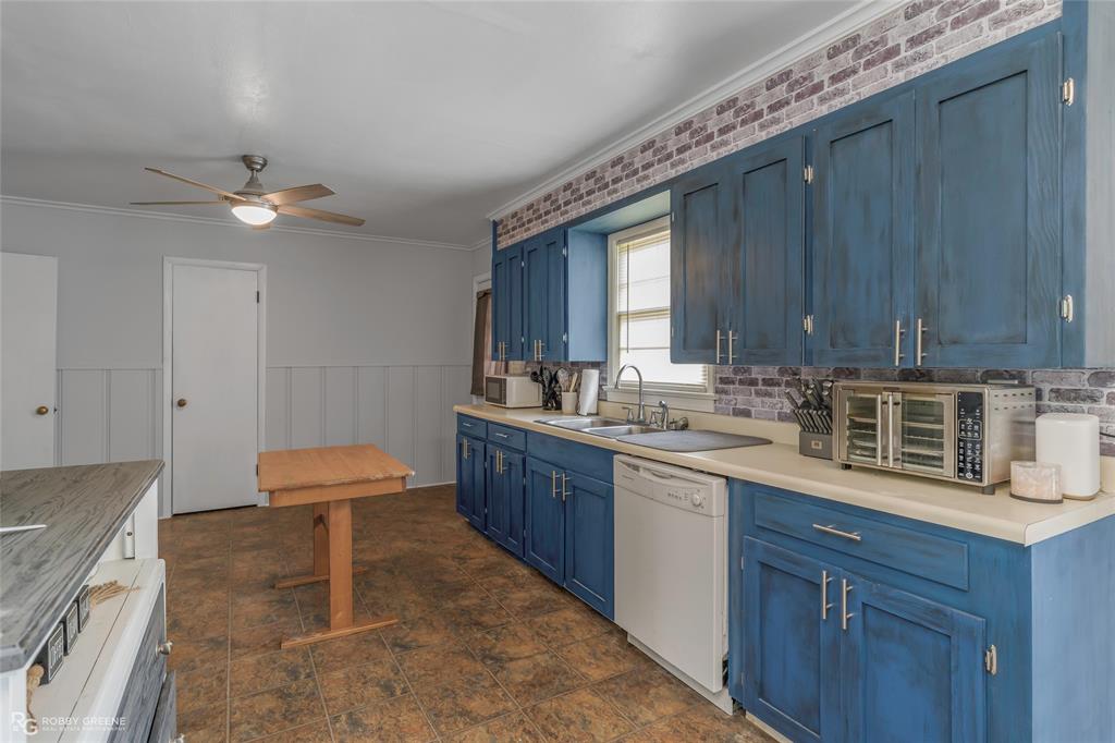 5725 Harper Road Keithville, LA 71047 - Photo 31 of 35 a kitchen with a sink cabinets and window