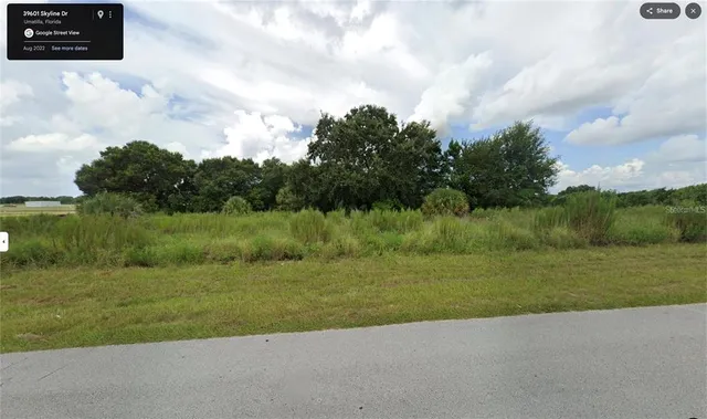 a view of a garden with a building