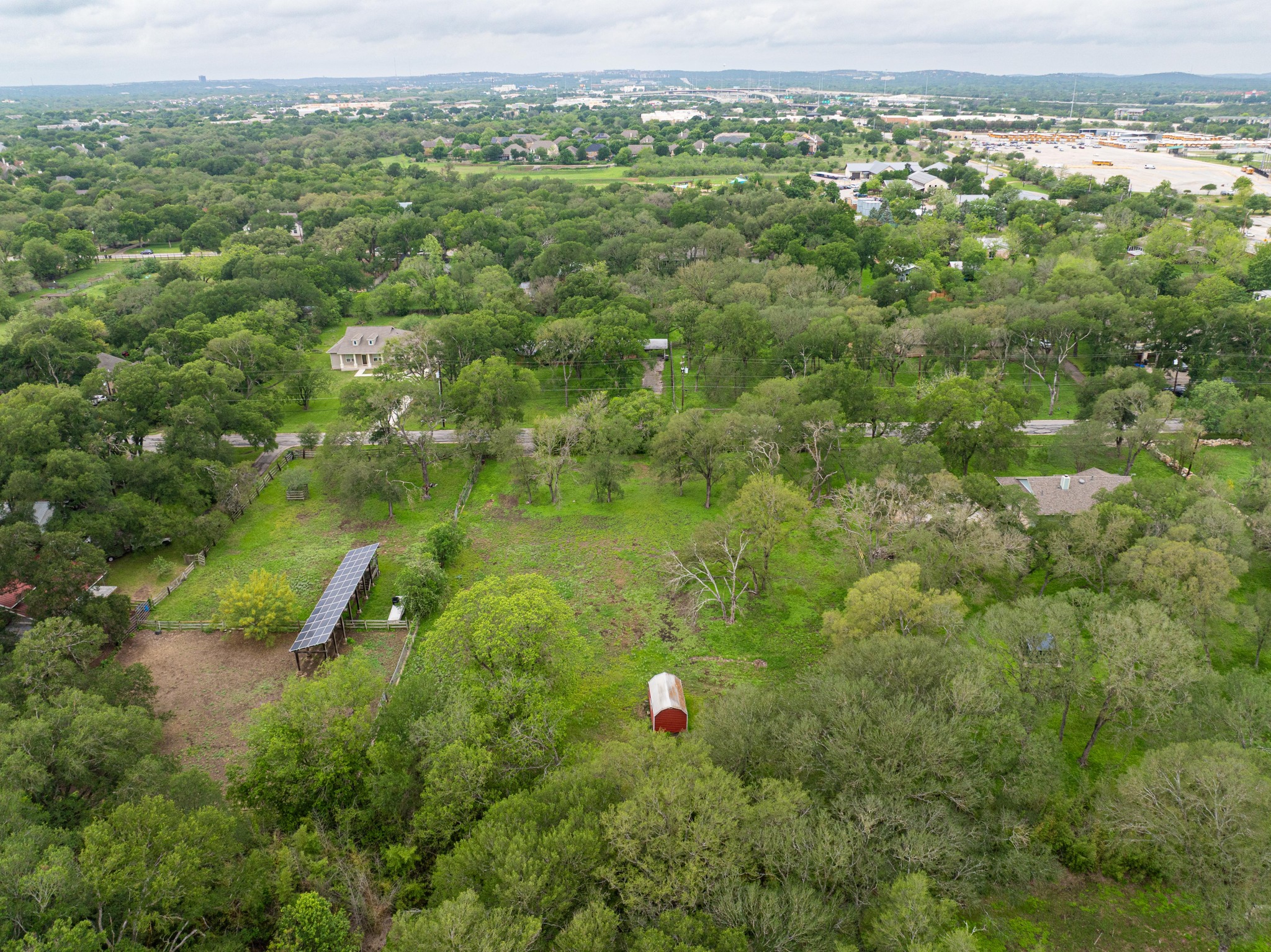 7 Pillow Road Sunset Valley, TX 78745 - Photo 15 of 22 an aerial view of residential houses with outdoor space and trees